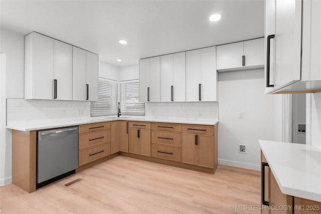 1400 W Jackson St, Broken Arrow, OK 74012 - kitchen with dishwasher, light wood-style flooring, light countertops, backsplash, and recessed lighting