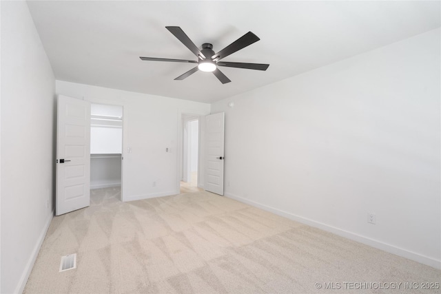 1400 W Jackson St, Broken Arrow, OK 74012 - unfurnished bedroom featuring carpet floors, a spacious closet, and ceiling fan