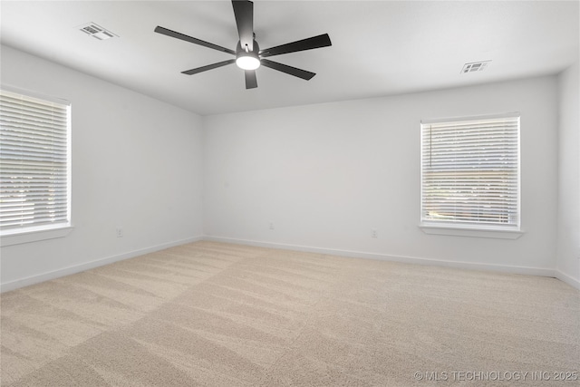 1400 W Jackson St, Broken Arrow, OK 74012 - unfurnished room featuring light colored carpet, plenty of natural light, and a ceiling fan