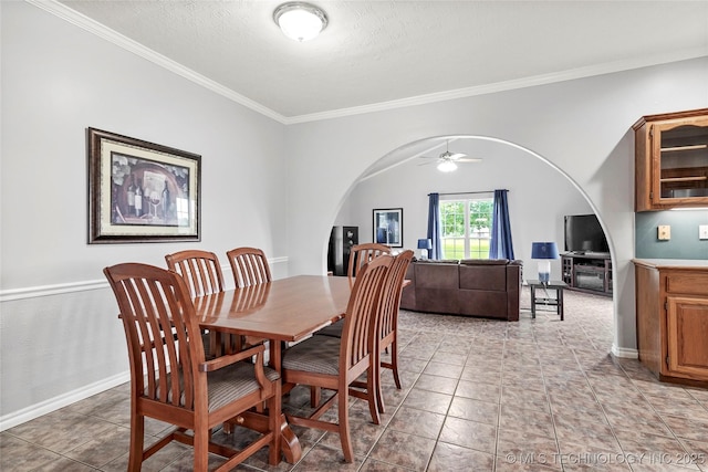 10672 E Canyon Oaks Ct, Claremore, OK 74017 - dining space featuring arched walkways, ornamental molding, a ceiling fan, light tile patterned flooring, and a textured ceiling