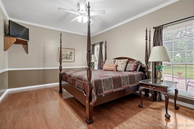 10672 E Canyon Oaks Ct, Claremore, OK 74017 - bedroom with wood finished floors, ornamental molding, and ceiling fan