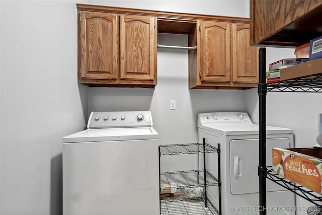 10672 E Canyon Oaks Ct, Claremore, OK 74017 - washroom with washing machine and dryer and cabinet space