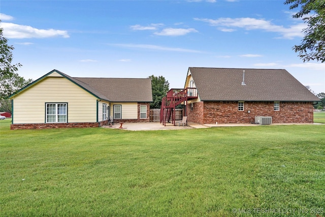 10672 E Canyon Oaks Ct, Claremore, OK 74017 - rear view of house featuring a patio area, a yard, brick siding, a deck, and roof with shingles