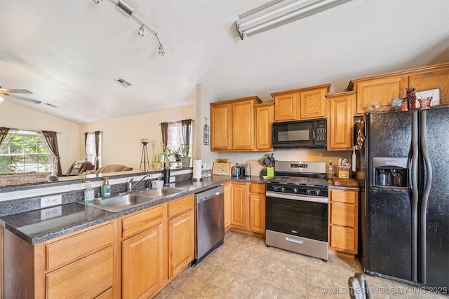 93 W Fairlane Pl, Sapulpa, OK 74066 - kitchen featuring black appliances, vaulted ceiling, ceiling fan, dark countertops, and rail lighting