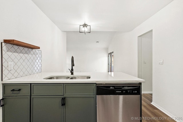 1847 W 57th Pl, Tulsa, OK 74107 - kitchen featuring dishwasher, light countertops, dark wood finished floors, and a peninsula