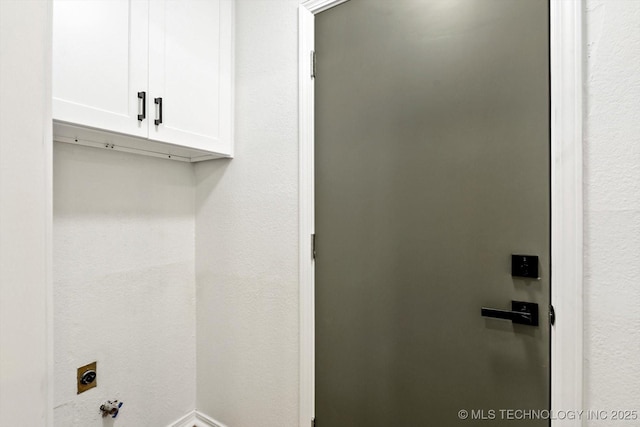 1847 W 57th Pl, Tulsa, OK 74107 - laundry room with cabinet space and electric dryer hookup