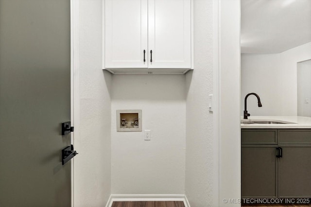 1847 W 57th Pl, Tulsa, OK 74107 - laundry room featuring hookup for a washing machine, cabinet space, and wood finished floors