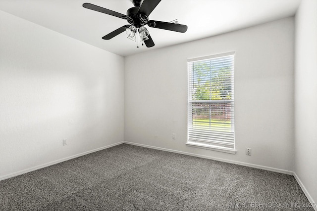 1847 W 57th Pl, Tulsa, OK 74107 - carpeted spare room featuring baseboards and a ceiling fan