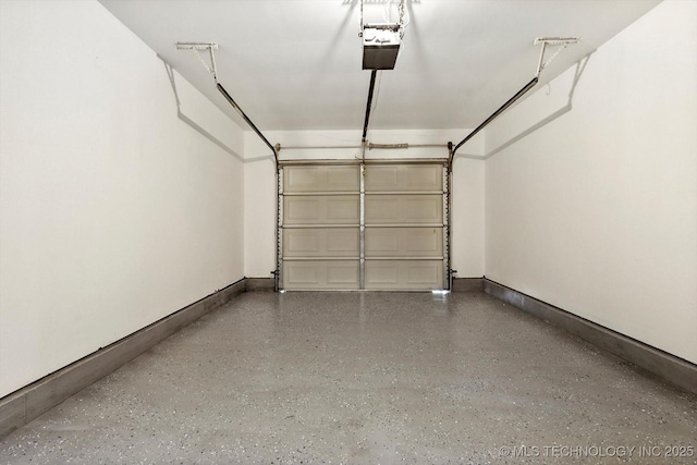 1847 W 57th Pl, Tulsa, OK 74107 - garage with a garage door opener and baseboards
