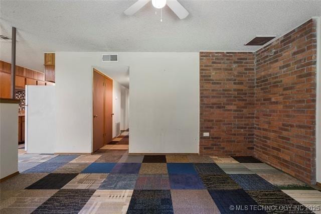 2608 Hickory Bluff Rd, Sapulpa, OK 74066 - empty room with a ceiling fan and a textured ceiling