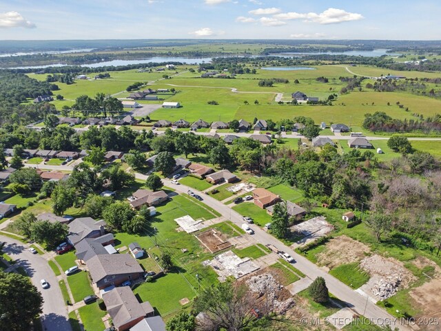 126 Birch Dr, Mannford, OK 74044 - aerial view of property and surrounding area featuring a large body of water and nearby suburban area