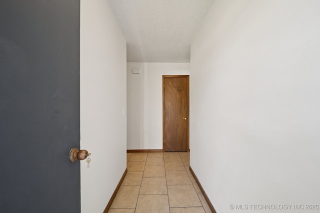 126 Birch Dr, Mannford, OK 74044 - hall with a textured ceiling and light tile patterned floors
