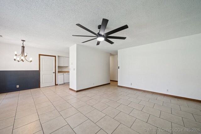 126 Birch Dr, Mannford, OK 74044 - empty room with a ceiling fan, a chandelier, and a textured ceiling