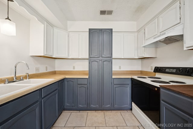 126 Birch Dr, Mannford, OK 74044 - kitchen with white range with electric stovetop, under cabinet range hood, a textured ceiling, white cabinets, and light tile patterned floors