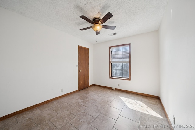 126 Birch Dr, Mannford, OK 74044 - empty room featuring a textured ceiling and ceiling fan