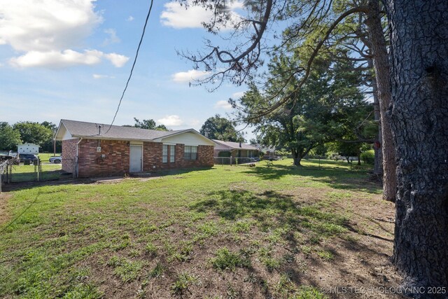 126 Birch Dr, Mannford, OK 74044 - view of yard with a gate