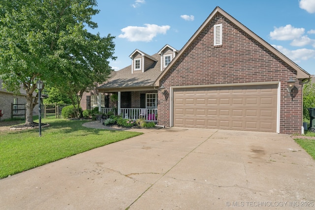 8702 N 140th Ter, Owasso, OK 74055 - view of front of property featuring brick siding, covered porch, a front lawn, concrete driveway, and an attached garage