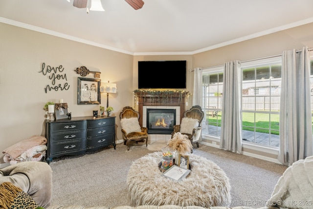 8702 N 140th Ter, Owasso, OK 74055 - living room with carpet floors, crown molding, a tile fireplace, and a ceiling fan