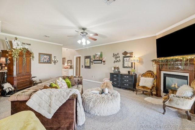 8702 N 140th Ter, Owasso, OK 74055 - carpeted living area with crown molding, a tile fireplace, and ceiling fan