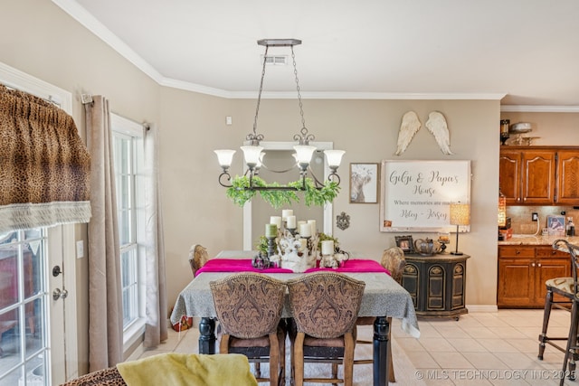8702 N 140th Ter, Owasso, OK 74055 - dining room with ornamental molding and light tile patterned floors