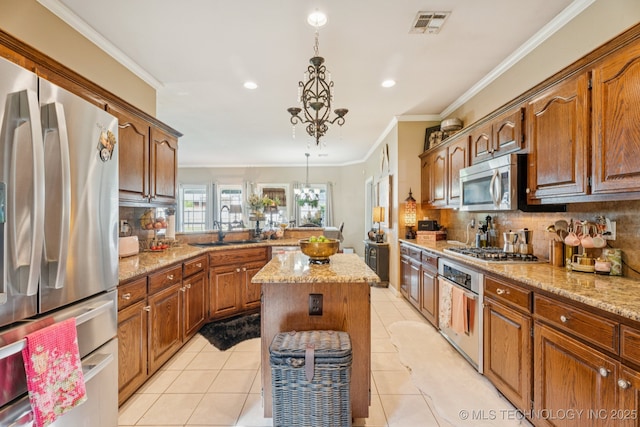 8702 N 140th Ter, Owasso, OK 74055 - kitchen featuring stainless steel appliances, backsplash, a peninsula, recessed lighting, and ornamental molding