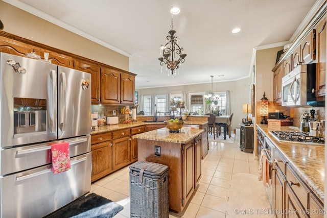 8702 N 140th Ter, Owasso, OK 74055 - kitchen with appliances with stainless steel finishes, tasteful backsplash, ornamental molding, brown cabinetry, and a peninsula