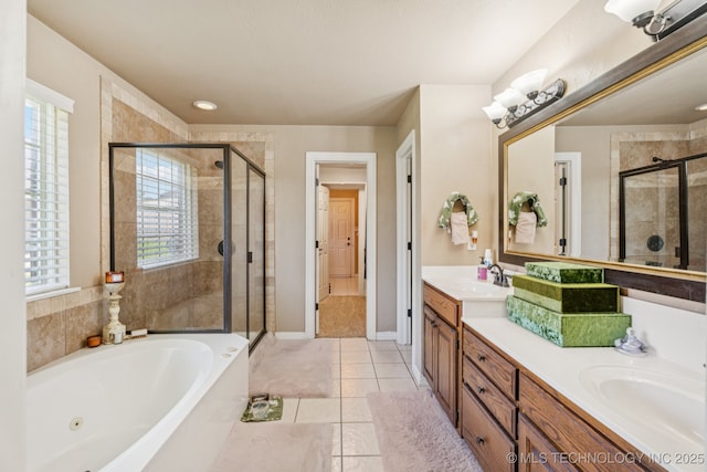 8702 N 140th Ter, Owasso, OK 74055 - full bath with a shower stall, double vanity, a jetted tub, and tile patterned flooring