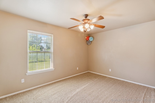 8702 N 140th Ter, Owasso, OK 74055 - unfurnished room featuring a ceiling fan and carpet
