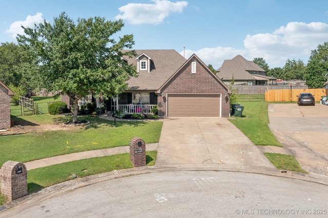 8702 N 140th Ter, Owasso, OK 74055 - view of front of property with brick siding, covered porch, driveway, an attached garage, and roof with shingles