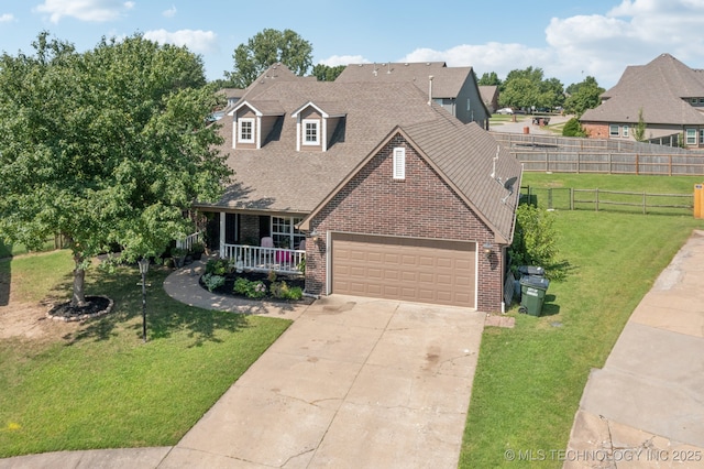 8702 N 140th Ter, Owasso, OK 74055 - view of front of property featuring brick siding, a porch, concrete driveway, and a garage