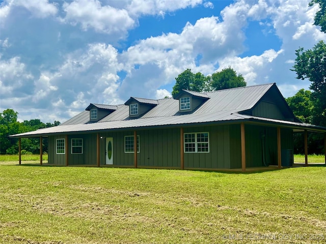 16547 County Road 1600, Ada, OK 74820 - view of front of home with board and batten siding, a front lawn, and a metal roof