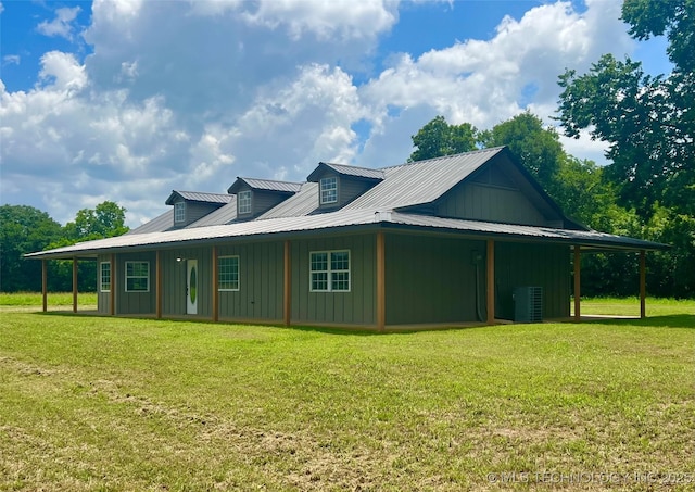 16547 County Road 1600, Ada, OK 74820 - view of side of home featuring board and batten siding, a yard, and a metal roof