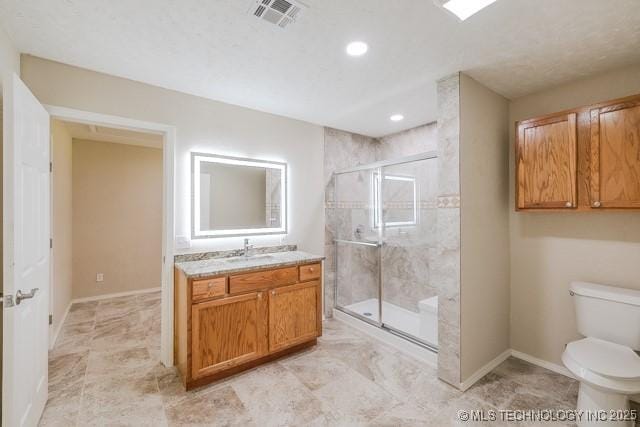 16547 County Road 1600, Ada, OK 74820 - full bathroom featuring vanity, a shower stall, and recessed lighting