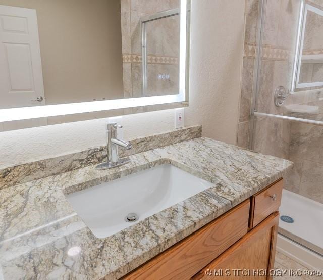 16547 County Road 1600, Ada, OK 74820 - full bathroom featuring vanity and a stall shower