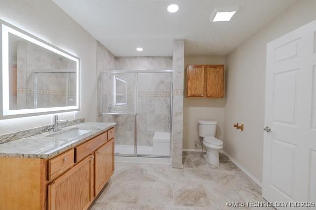 16547 County Road 1600, Ada, OK 74820 - full bath with vanity, a shower stall, and recessed lighting