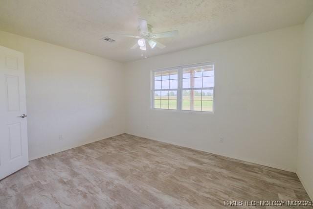 16547 County Road 1600, Ada, OK 74820 - unfurnished room featuring a ceiling fan and a textured ceiling