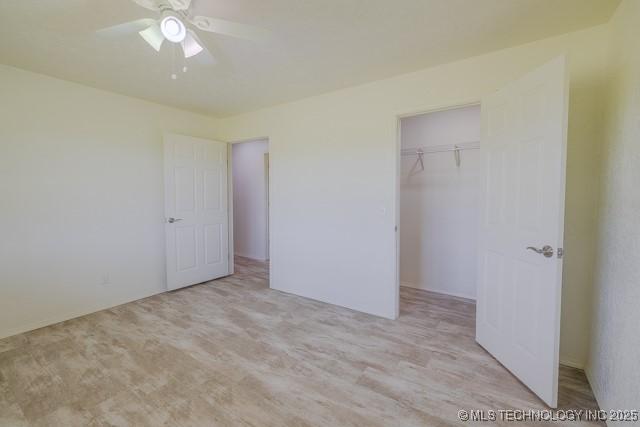 16547 County Road 1600, Ada, OK 74820 - unfurnished bedroom featuring a spacious closet and a ceiling fan