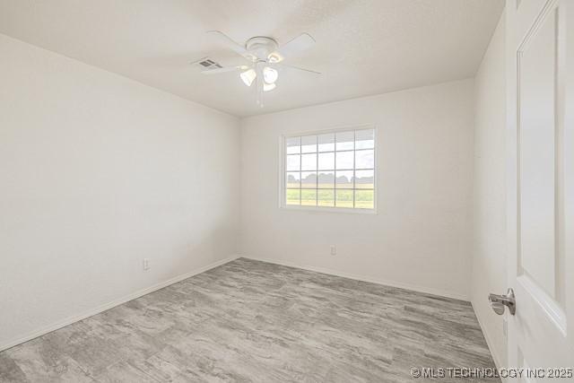 16547 County Road 1600, Ada, OK 74820 - unfurnished room featuring ceiling fan and baseboards