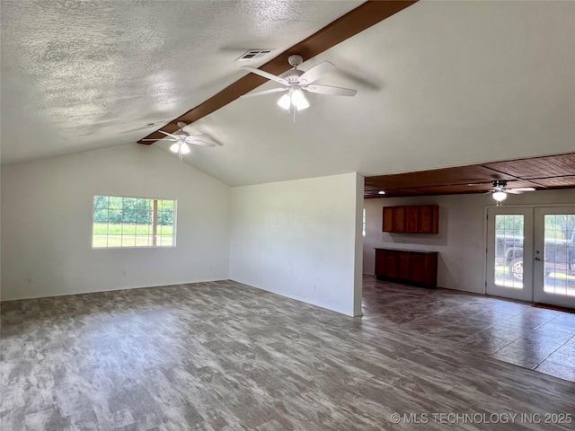 16547 County Road 1600, Ada, OK 74820 - unfurnished living room with a ceiling fan, french doors, healthy amount of natural light, and a textured ceiling