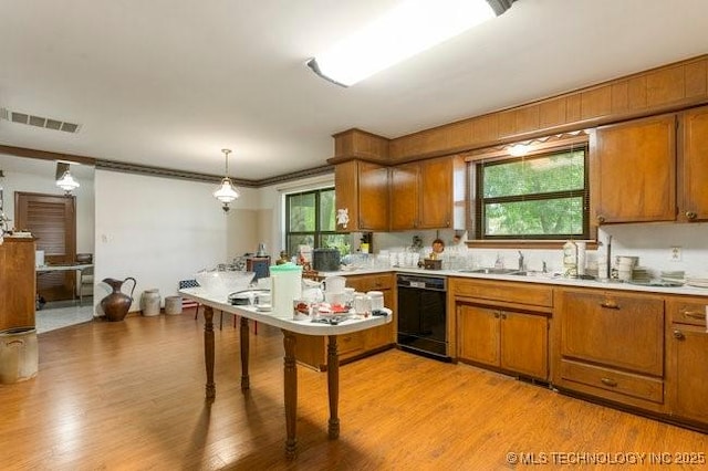 12725 S 168th E Ave, Broken Arrow, OK 74011 - kitchen featuring black dishwasher, brown cabinets, light countertops, and light wood-type flooring