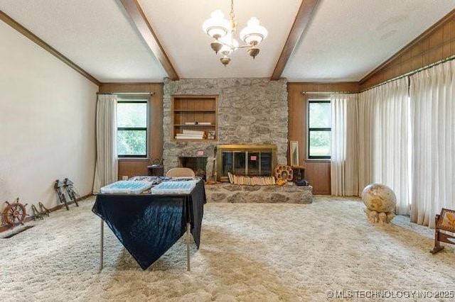 12725 S 168th E Ave, Broken Arrow, OK 74011 - carpeted living area featuring healthy amount of natural light, a chandelier, beamed ceiling, and a fireplace