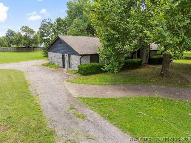 12725 S 168th E Ave, Broken Arrow, OK 74011 - view of front of property featuring driveway, stone siding, and a front yard