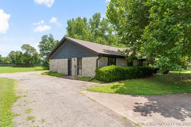 12725 S 168th E Ave, Broken Arrow, OK 74011 - view of property exterior featuring stone siding and driveway