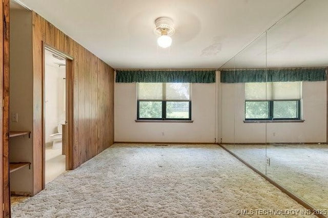 12725 S 168th E Ave, Broken Arrow, OK 74011 - carpeted spare room with plenty of natural light and wood walls