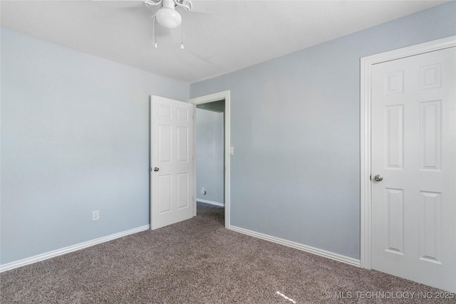 6711 E 10th St, Tulsa, OK 74112 - unfurnished bedroom featuring carpet floors and a ceiling fan