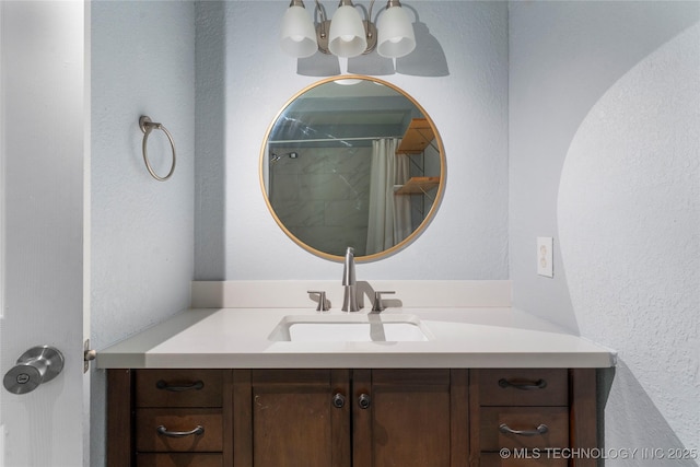 6711 E 10th St, Tulsa, OK 74112 - full bathroom with vanity, a shower with curtain, a chandelier, and a textured wall