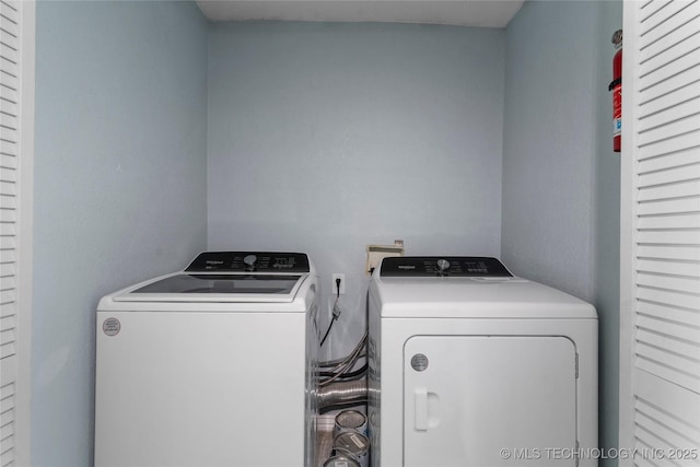 6711 E 10th St, Tulsa, OK 74112 - washroom with washing machine and dryer