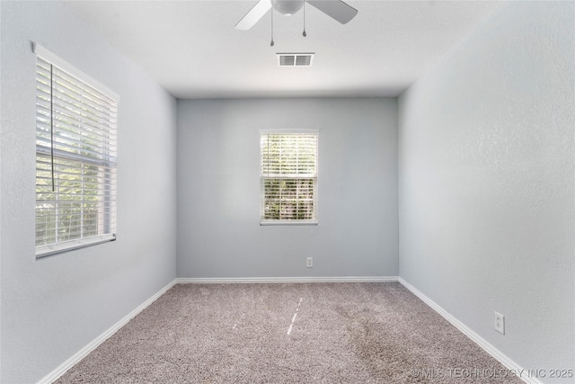 6711 E 10th St, Tulsa, OK 74112 - carpeted spare room featuring a ceiling fan and baseboards