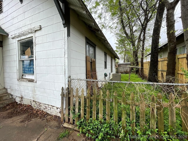 1225 S Quaker Ave, Tulsa, OK 74120 - view of side of property featuring a central air condition unit