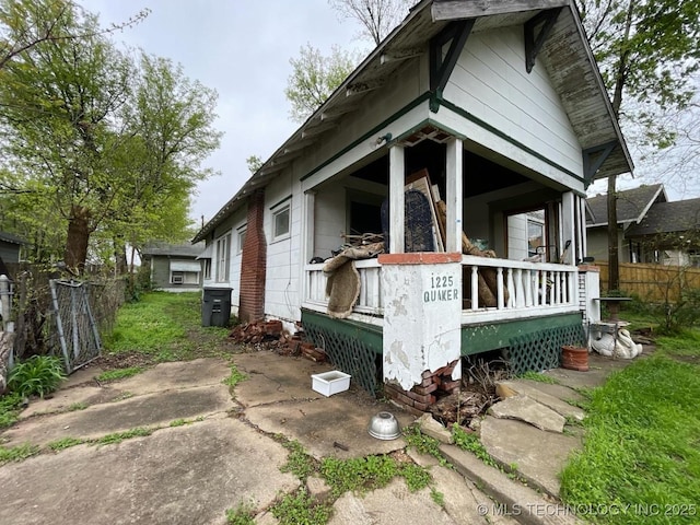 1225 S Quaker Ave, Tulsa, OK 74120 - view of side of property featuring covered porch